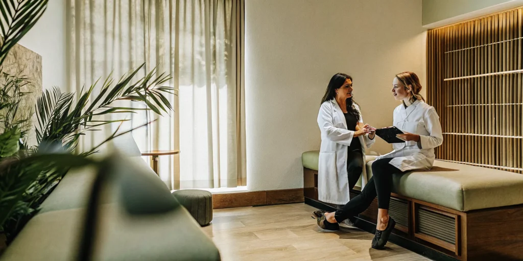 Woman discussing PCOS insulin resistance and fertility with a physician